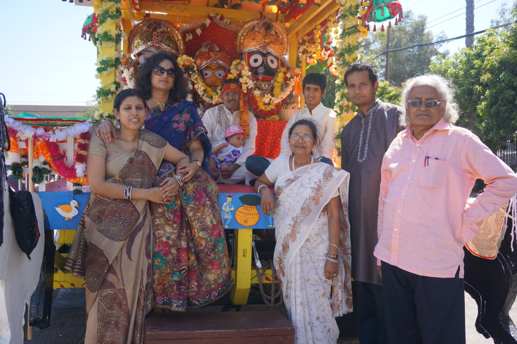 The Das family in front of a Ratha Yatra chariot
